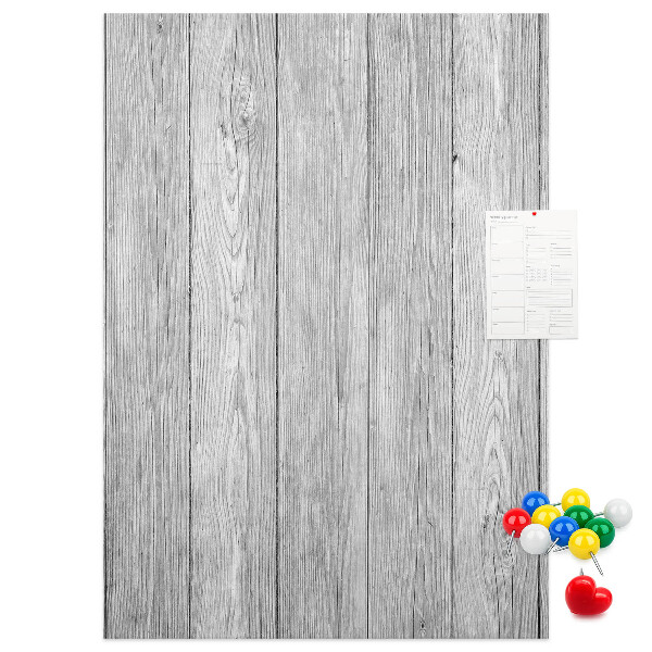 Kurken prikbord met een achtergrond van grijze houten planken