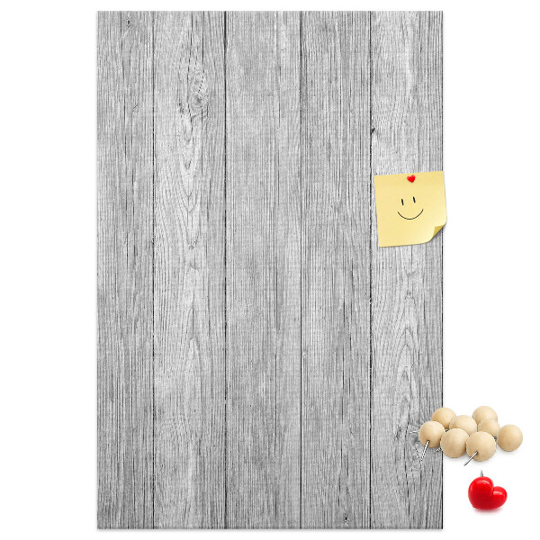 Kurken prikbord met een achtergrond van grijze houten planken
