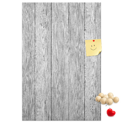 Kurken prikbord met een achtergrond van grijze houten planken