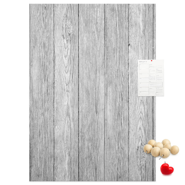 Kurken prikbord met een achtergrond van grijze houten planken