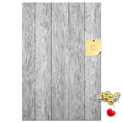 Kurken prikbord met een achtergrond van grijze houten planken