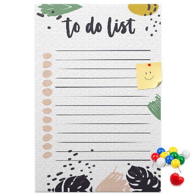 Kurken prikbord met een print van kleurrijke bladeren op een takenlijst