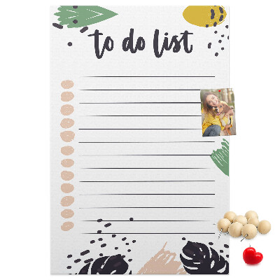 Kurken prikbord met een print van kleurrijke bladeren op een takenlijst