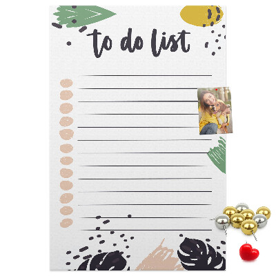 Kurken prikbord met een print van kleurrijke bladeren op een takenlijst