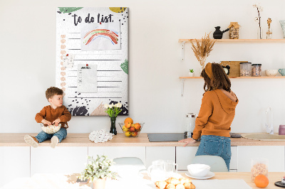 Kurken prikbord met een print van kleurrijke bladeren op een takenlijst