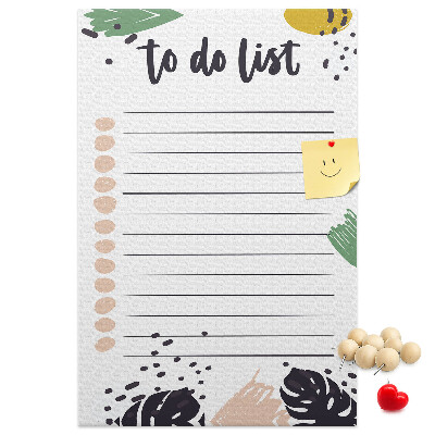 Kurken prikbord met een print van kleurrijke bladeren op een takenlijst