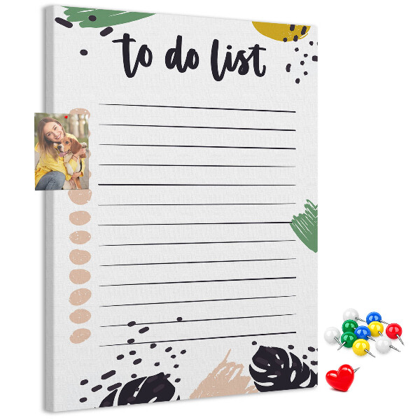 Kurken prikbord met een print van kleurrijke bladeren op een takenlijst