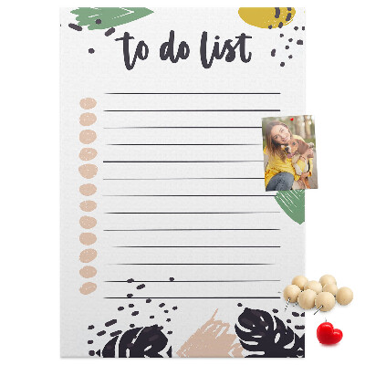 Kurken prikbord met een print van kleurrijke bladeren op een takenlijst