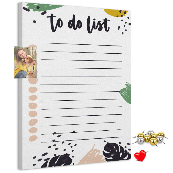 Kurken prikbord met een print van kleurrijke bladeren op een takenlijst