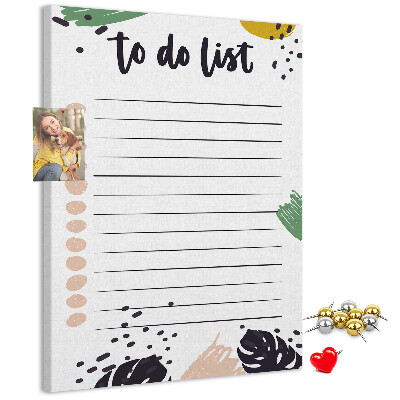 Kurken prikbord met een print van kleurrijke bladeren op een takenlijst