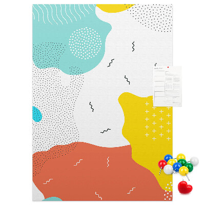 Kurken memobord met kleurrijke abstracte vormen en patronen