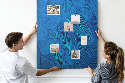 Kurken memobord met de afbeelding Blauwe veren in het zachte licht