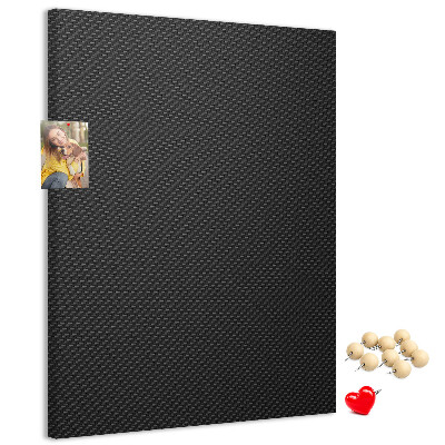 Prikbord van kurk met zwarte textuur en een subtiel houtskoolpatroon