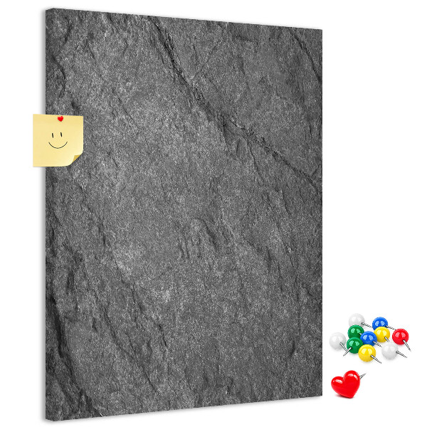 Prikbord van kurk met grijszwarte natuursteenstructuur