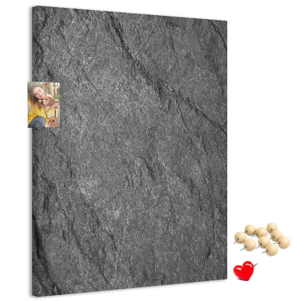 Prikbord van kurk met grijszwarte natuursteenstructuur