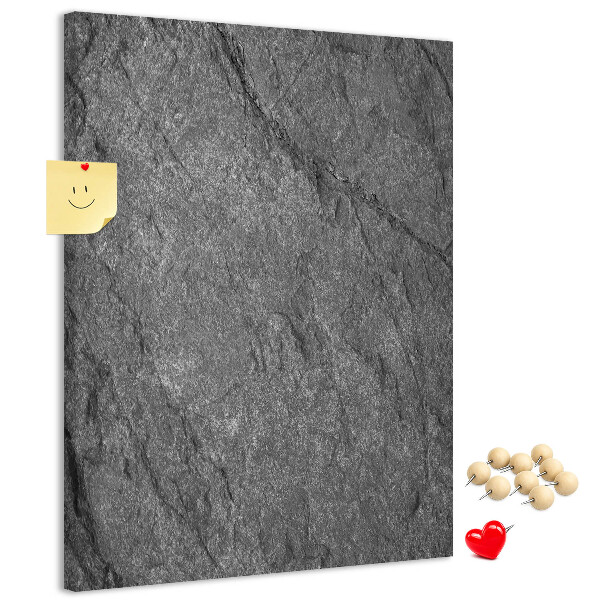 Prikbord van kurk met grijszwarte natuursteenstructuur