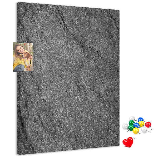 Prikbord van kurk met grijszwarte natuursteenstructuur