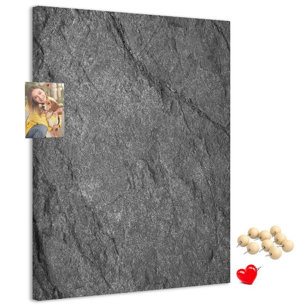 Prikbord van kurk met grijszwarte natuursteenstructuur