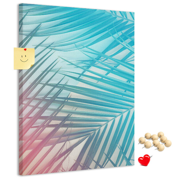 Memobord van kurk met tropische palmbladeren in pasteltinten