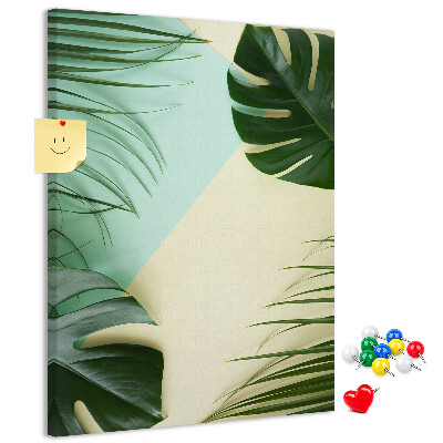 Kurken prikbord met een ontwerp van palmbladeren op een pastelkleurige achtergrond