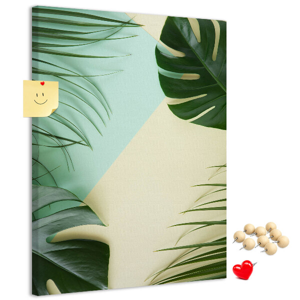 Kurken prikbord met een ontwerp van palmbladeren op een pastelkleurige achtergrond