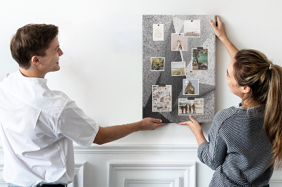 Prikbord van kurk met betongeometrie in grijstinten