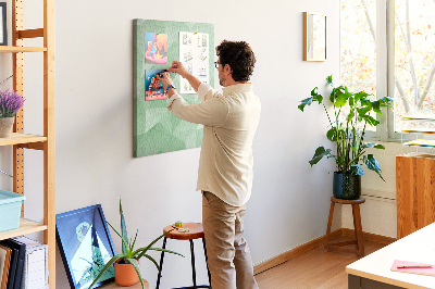 Prikbord van kurk met geometrische vormen in groene tinten