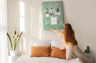 Prikbord van kurk met geometrische vormen in groene tinten