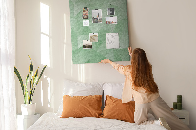 Prikbord van kurk met geometrische vormen in groene tinten