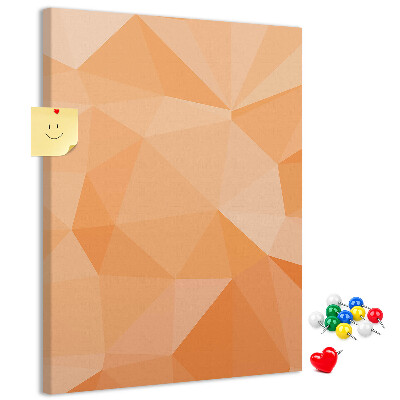 Kurk prikbord met geometrische vormen in oranje en beige tinten