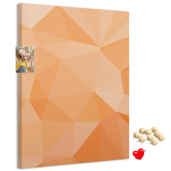 Kurk prikbord met geometrische vormen in oranje en beige tinten