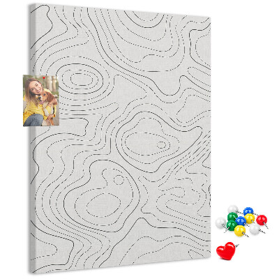 Memobord van kurk met abstracte lijnen en golven op de achtergrond