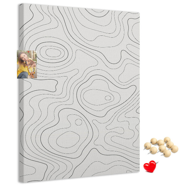 Memobord van kurk met abstracte lijnen en golven op de achtergrond