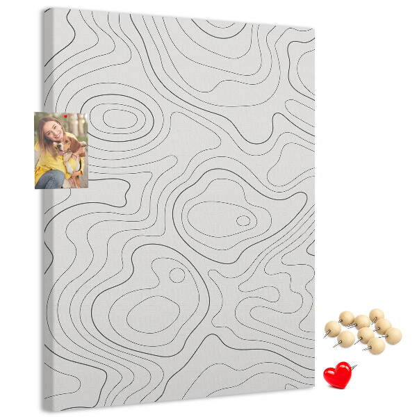 Memobord van kurk met abstracte lijnen en golven op de achtergrond