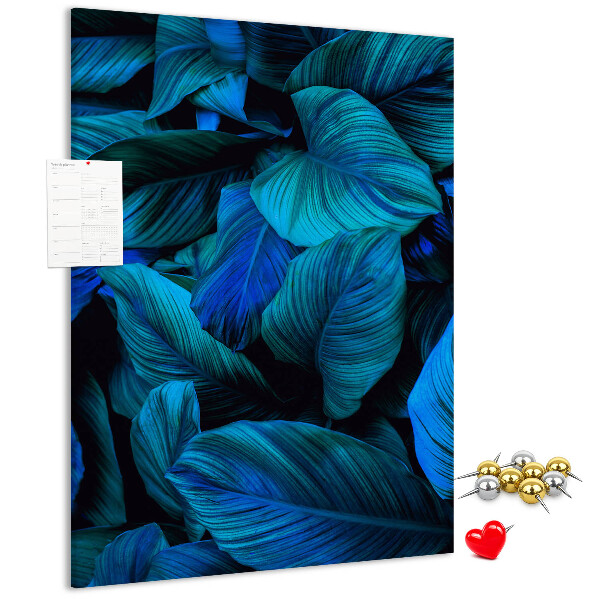 Memobord van kurk met nachtbladeren in verschillende tinten blauw