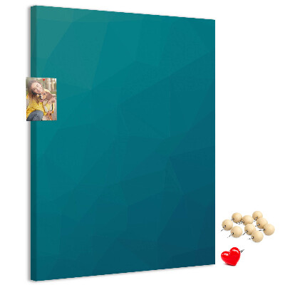 Kurken prikbord met geometrische blauwtinten op de achtergrond