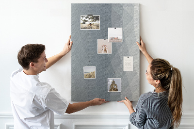 Kurken memobord met geometrisch patroon in grijstinten