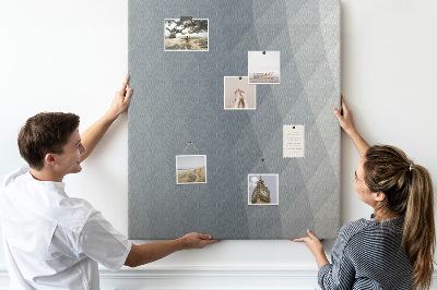 Kurken memobord met geometrisch patroon in grijstinten
