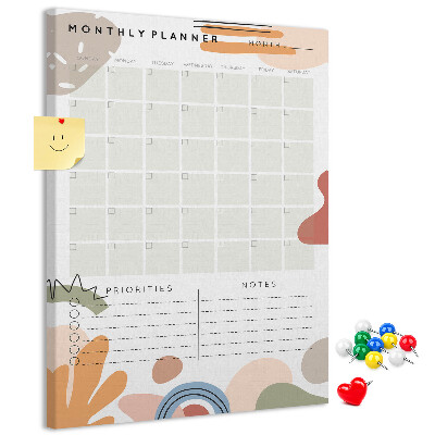 Kurken memobord maandplanner met kleurrijke abstracte vormen