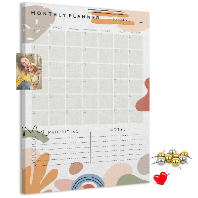 Kurken memobord maandplanner met kleurrijke abstracte vormen