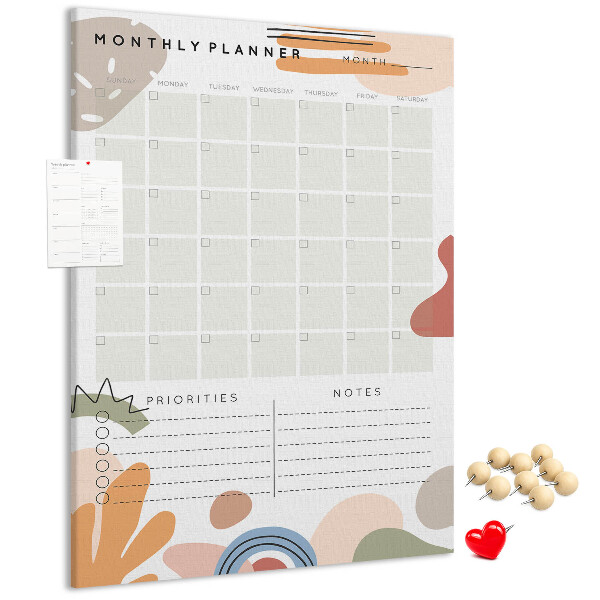 Kurken memobord maandplanner met kleurrijke abstracte vormen