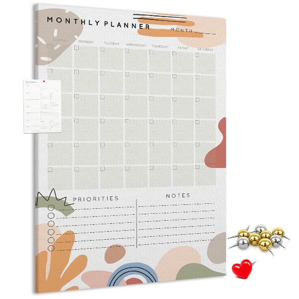 Kurken memobord maandplanner met kleurrijke abstracte vormen