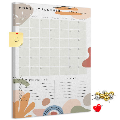Kurken memobord maandplanner met kleurrijke abstracte vormen