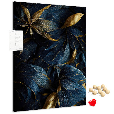 Prikbord van kurk met print van gouden bladeren op een donkere achtergrond