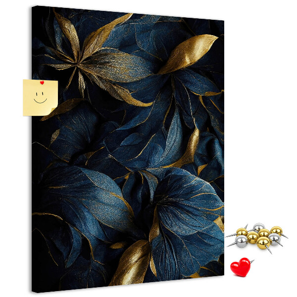 Prikbord van kurk met print van gouden bladeren op een donkere achtergrond