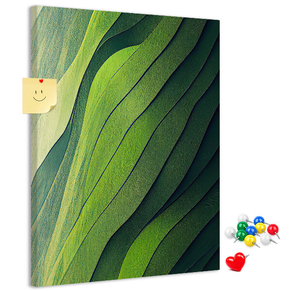 Memobord van kurk met een motief van groene bladeren in subtiele tinten