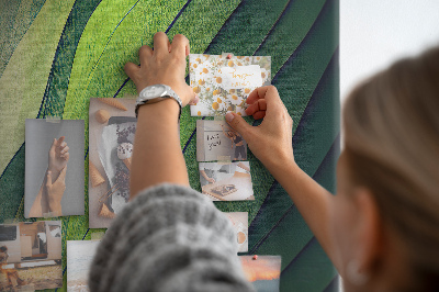 Memobord van kurk met een motief van groene bladeren in subtiele tinten
