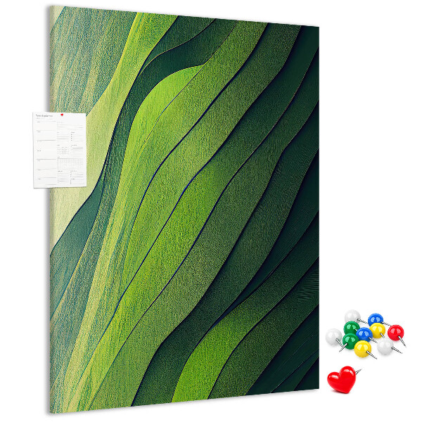 Memobord van kurk met een motief van groene bladeren in subtiele tinten