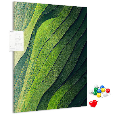 Memobord van kurk met een motief van groene bladeren in subtiele tinten