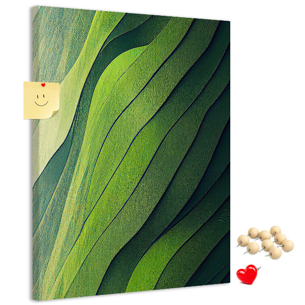Memobord van kurk met een motief van groene bladeren in subtiele tinten